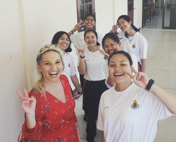 Accredited TEFL graduate taking a smiling selfie with her students at a school placement in Thailand