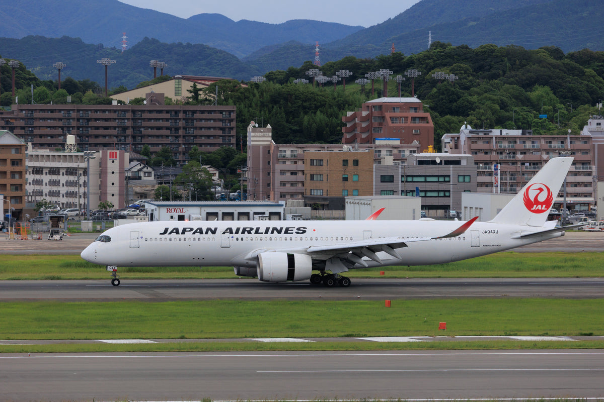 Japan Airlines plane on the runway, the first step for English teachers arriving on a Japan work visa