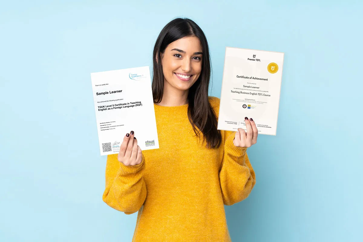 Teacher in a yellow sweater holding two TEFL micro-credential certificates that can boost her pay