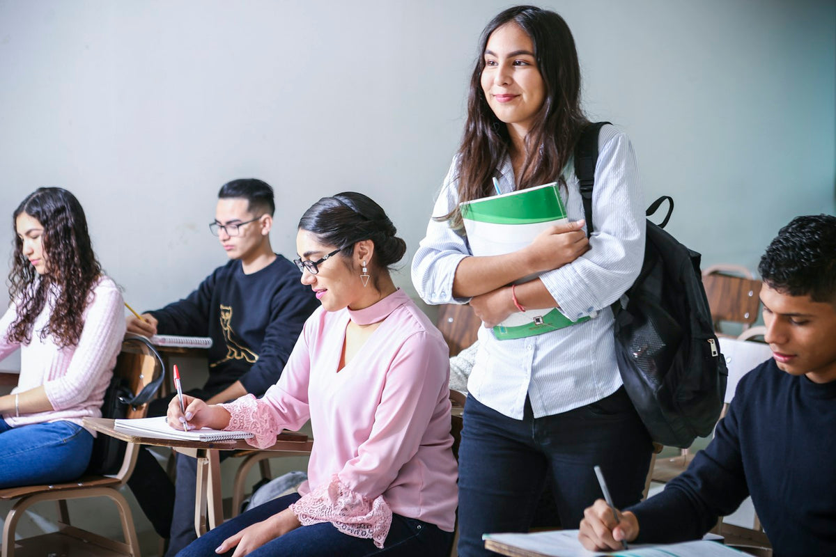 Adult students in a classroom comparing CELTA vs TEFL certification routes