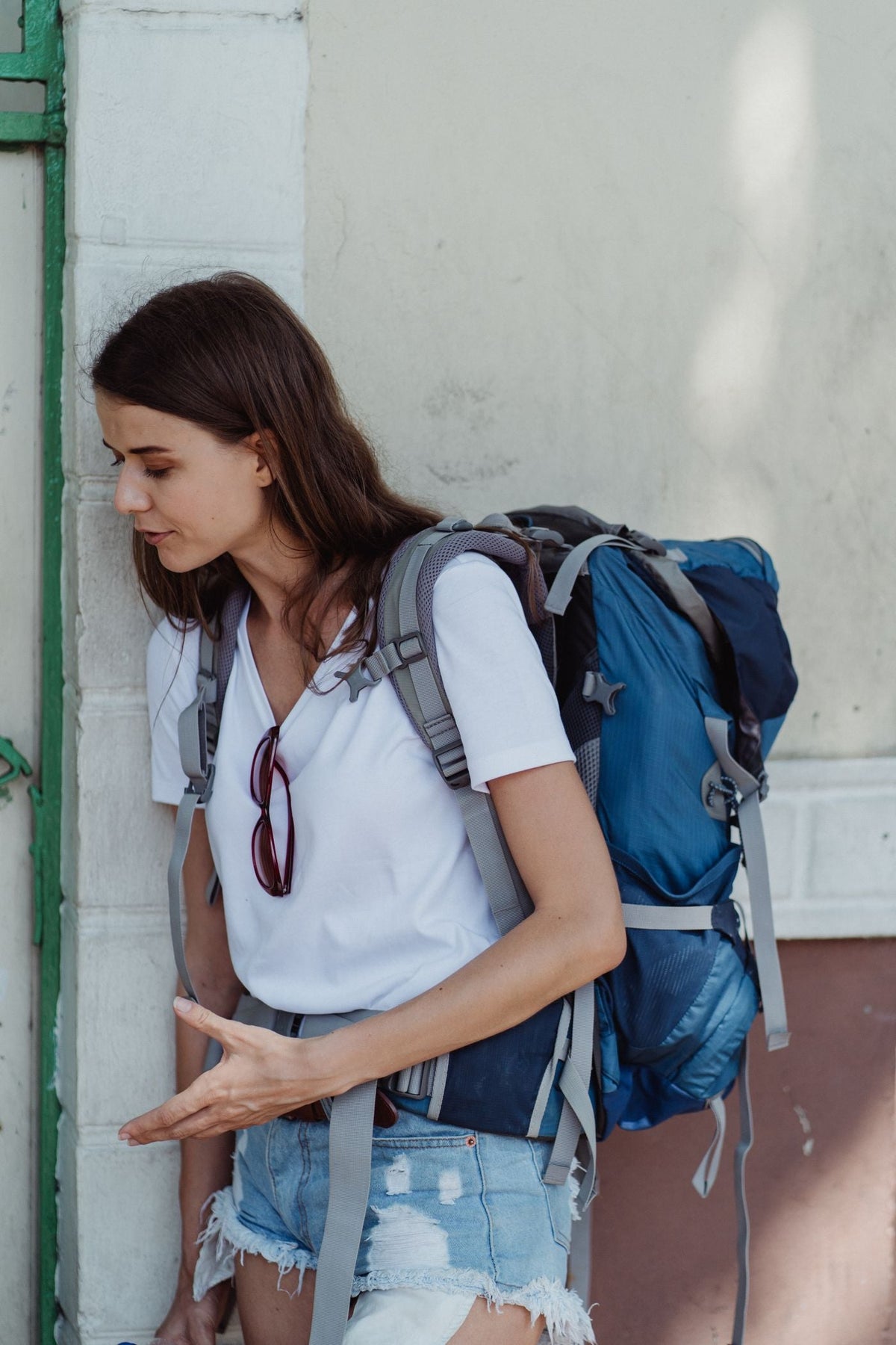 Young female traveler with a backpack exploring a new destination during her gap year before college