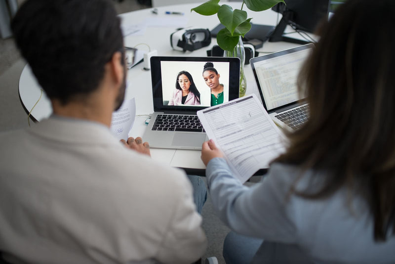 Remote English teacher preparing for an online job interview with a laptop