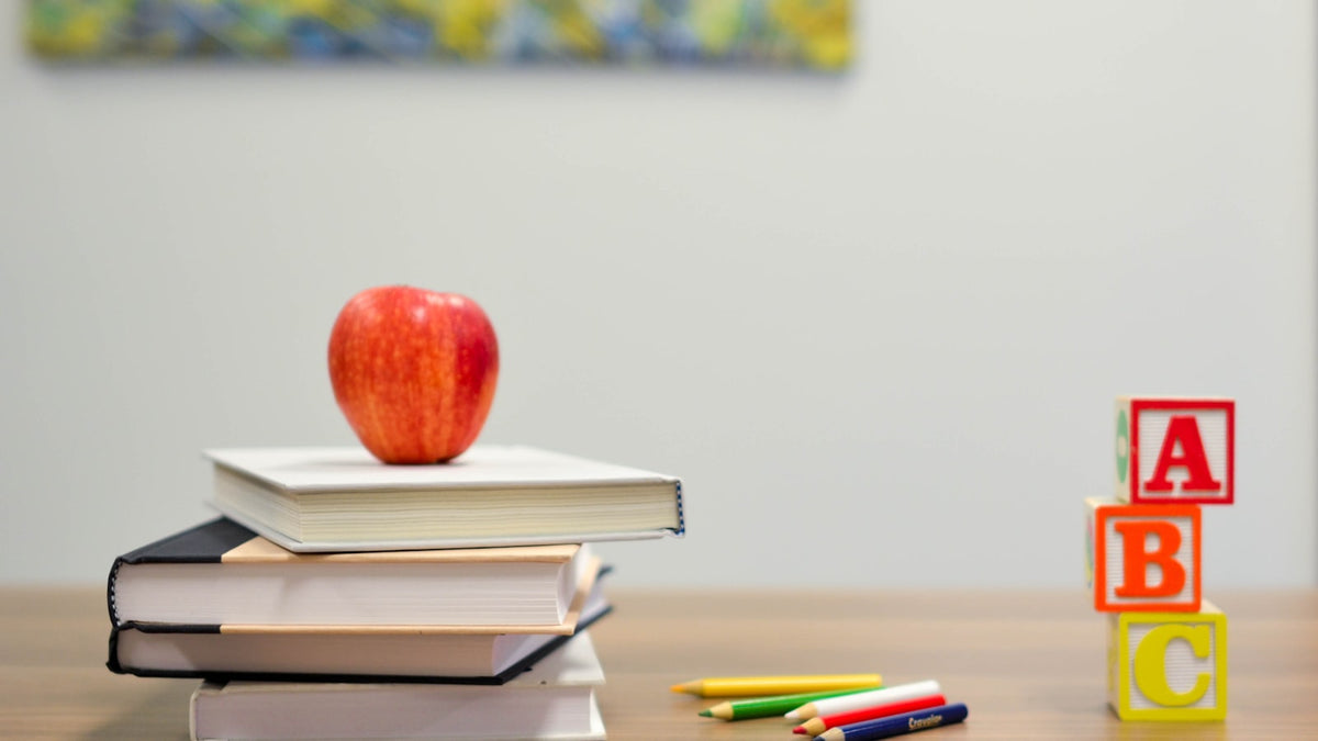 what is a tefl course books apple and study materials on desk