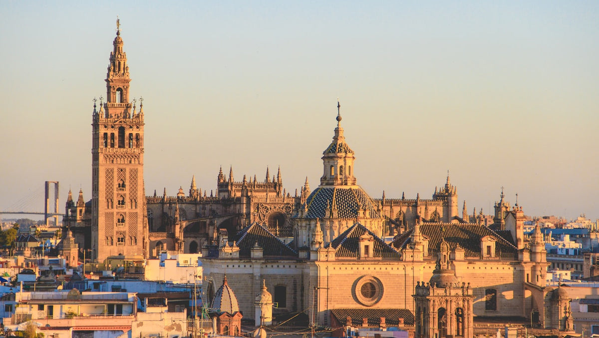 The Giralda tower above Seville rooftops in Spain, a popular destination for TEFL certified English teachers