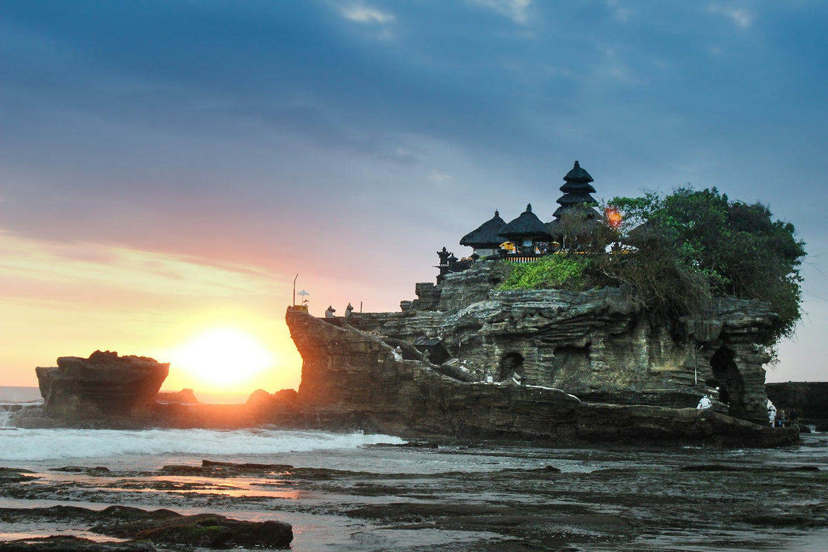 Tanah Lot temple at sunset in Bali, a landmark near many jobs teaching english in bali