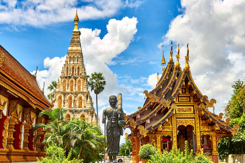 Gap year traveler exploring a temple in Thailand while teaching English abroad