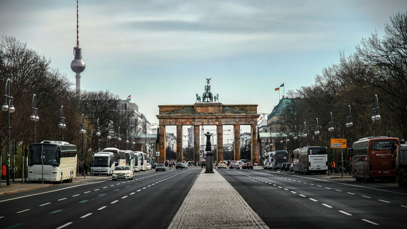 The Brandenburg Gate and the Berlin TV Tower on a cloudy day in the German capital
