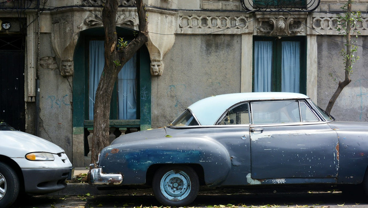 Classic car parked on a Mexican street near the private schools that hire foreign English teachers
