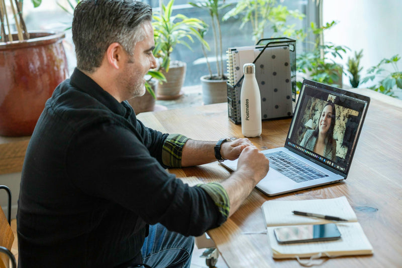 Online exam prep tutor on a video call helping a student prepare for IELTS or TOEFL