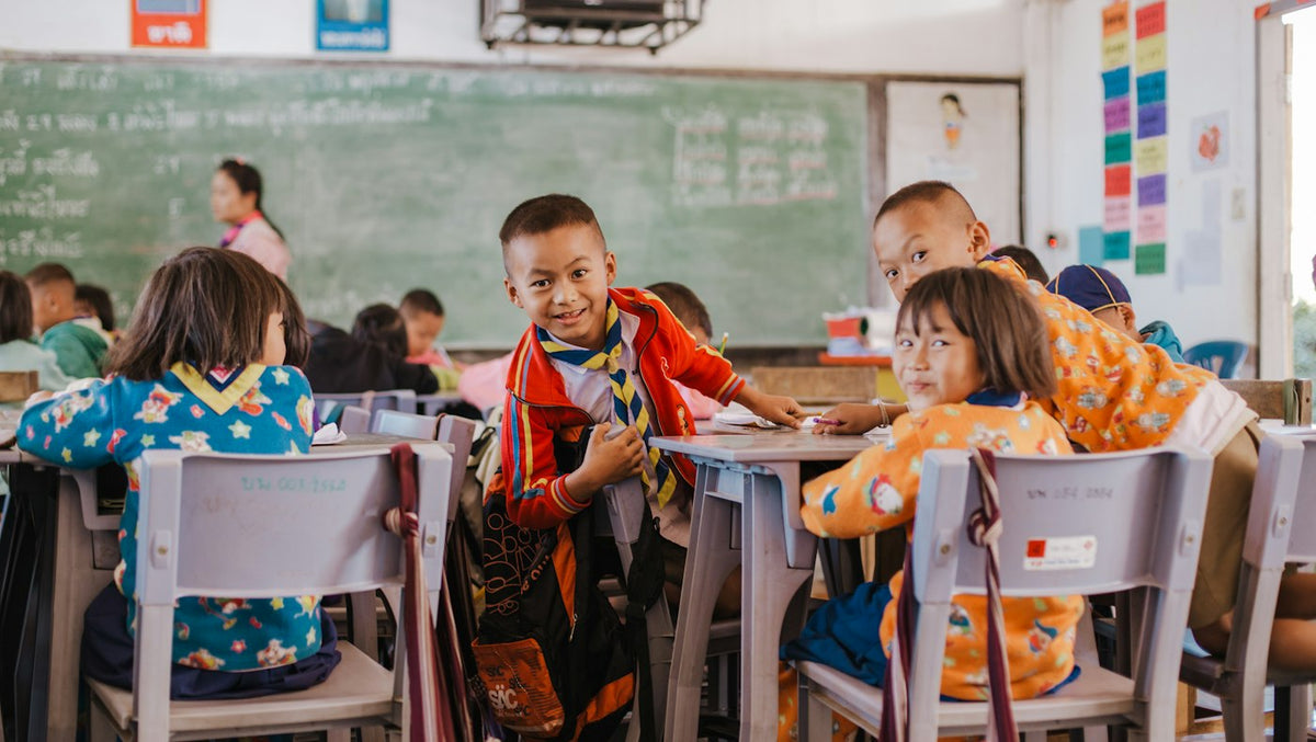 Children at their desks in a school classroom in rural northern Thailand, where many foreign English teachers work