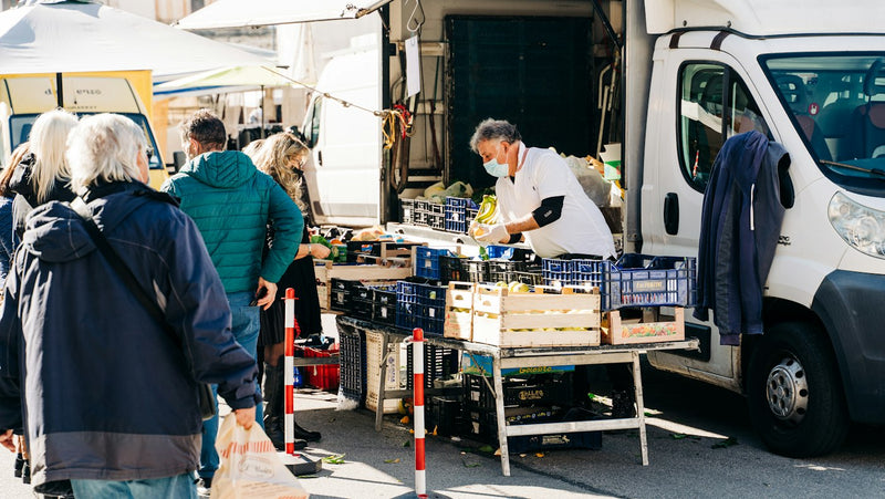 Farmers' market stall in Sulmona, Italy, where teachers buy cheap local produce