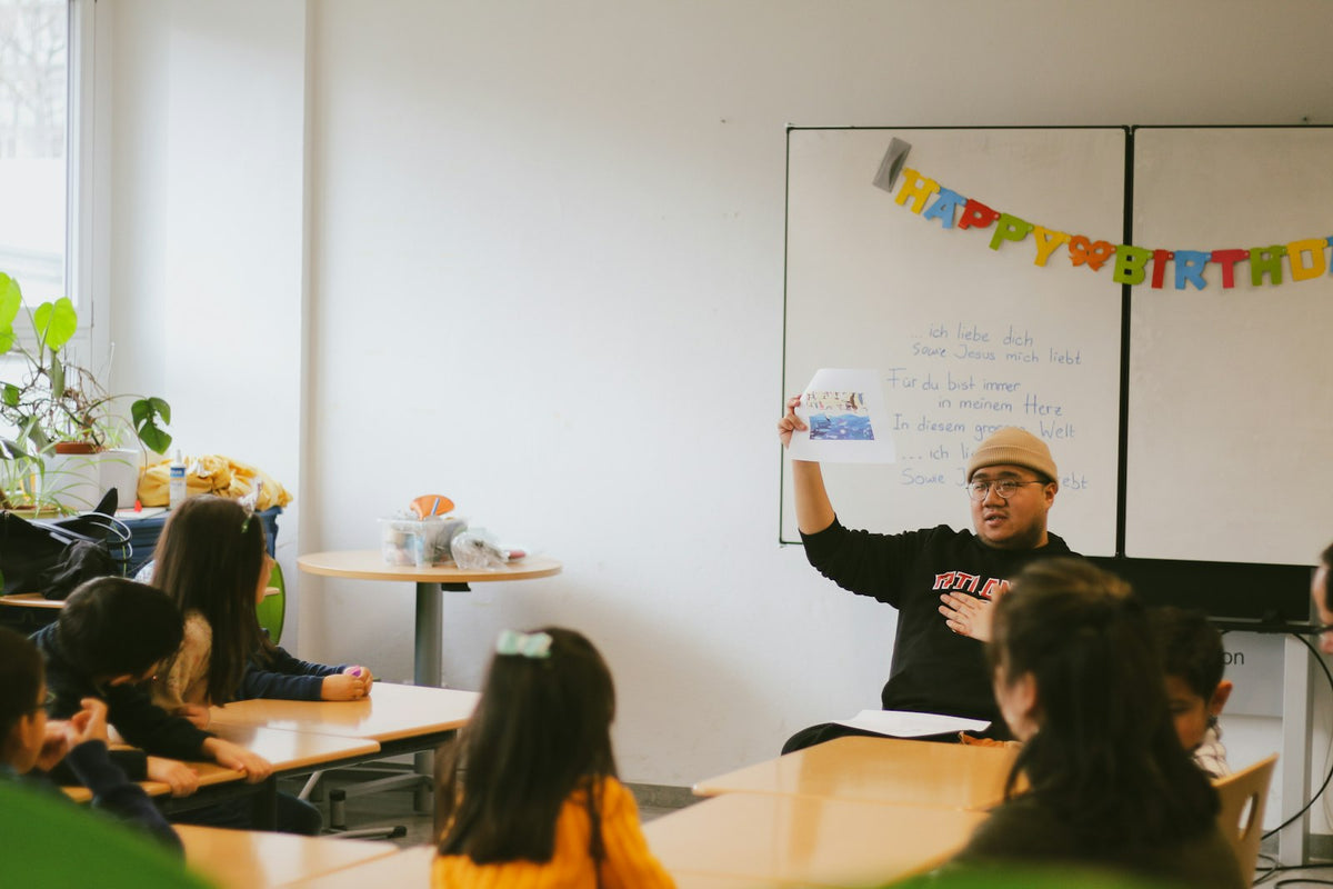 English teacher comparing TEFL TESOL and CELTA certification options at a desk