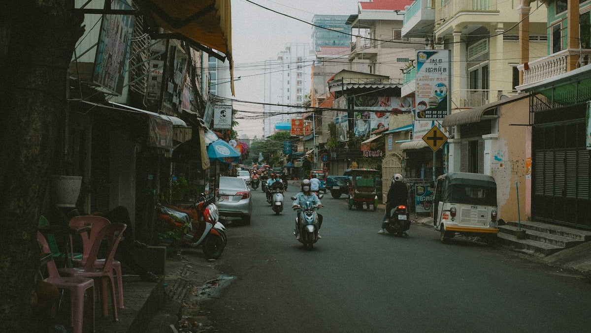Busy Phnom Penh street with motorbike traffic, the city where most English teaching jobs in Cambodia are based