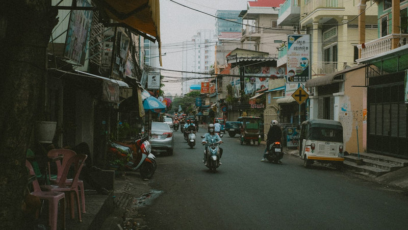 Busy Phnom Penh street with motorbike traffic, the city where most English teaching jobs in Cambodia are based