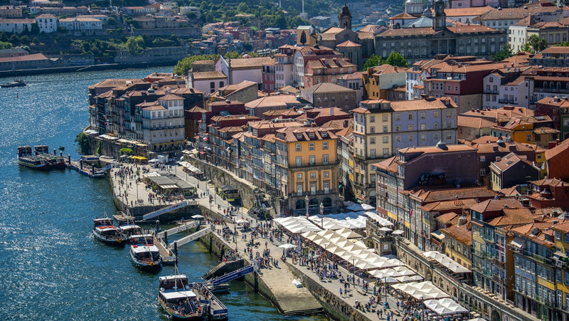 Busy Douro riverfront in Porto, one of the lifestyle draws of living in Portugal as a teacher