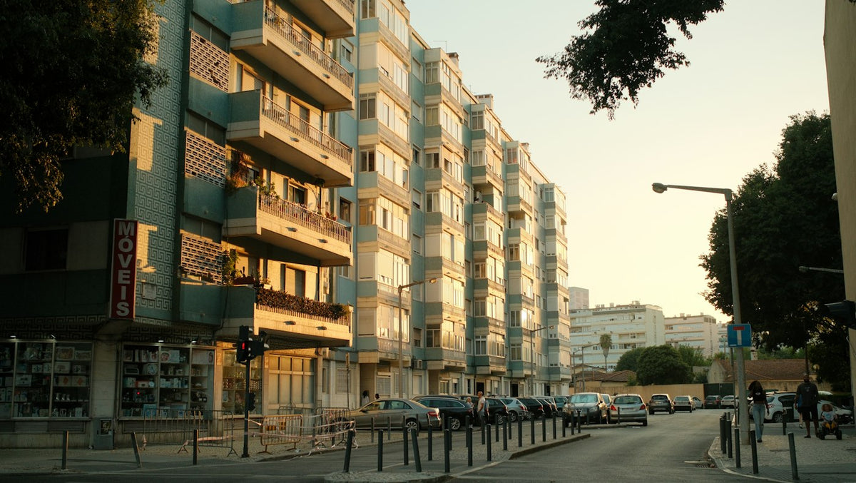Apartment buildings in Benfica Lisbon at golden hour where English teachers rent affordable one bedroom flats
