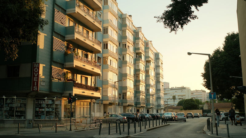 Apartment buildings in Benfica Lisbon at golden hour where English teachers rent affordable one bedroom flats