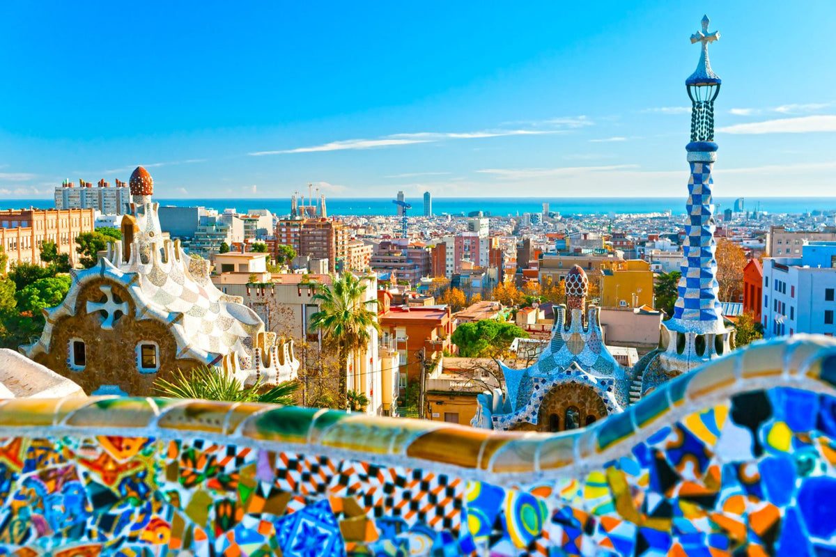 View over Barcelona from Park Guell's mosaic terraces, one of the best cities to teach English in Spain