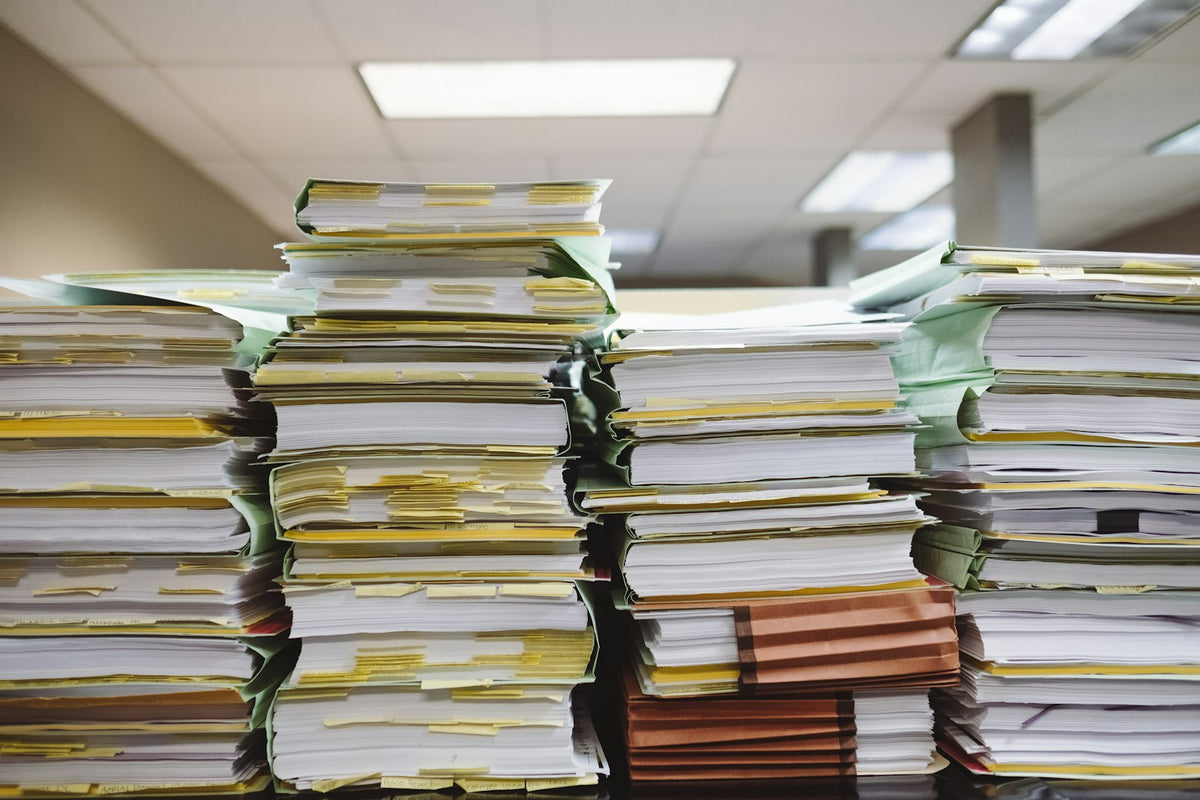 Official paperwork and documents on a desk, representing TEFL accreditation verification