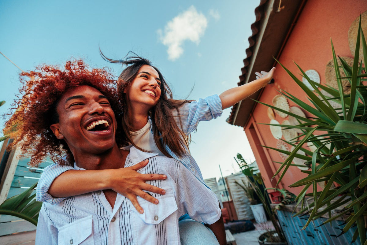 Friends laughing together in the sun