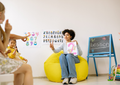 English teacher explaining advanced grammar concepts and sentence structure in a classroom lesson