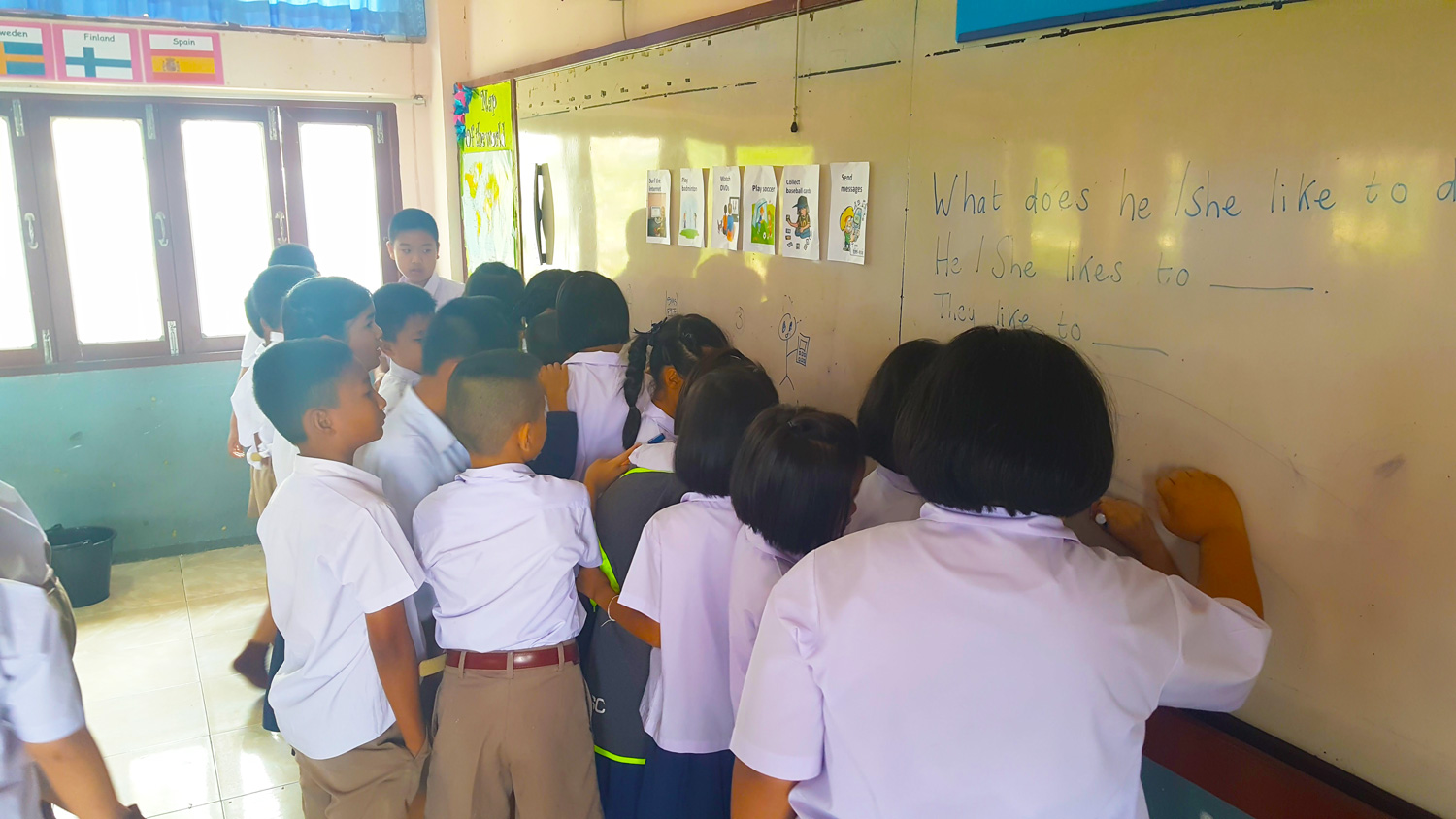 Students writing on whiteboard
