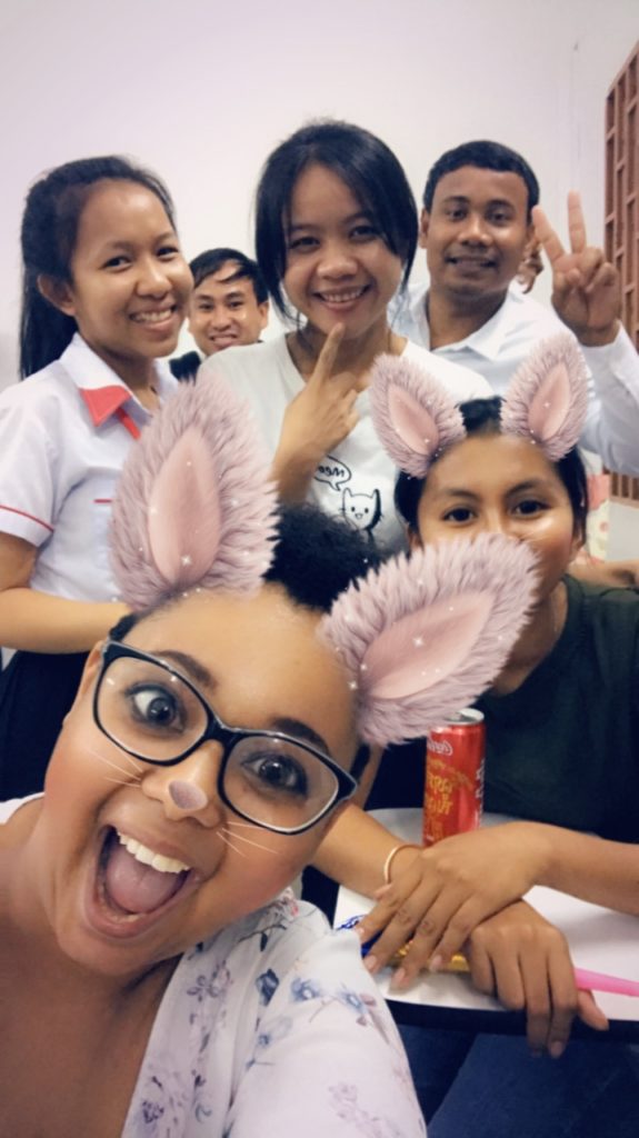 Eva taking a selfie with her students.