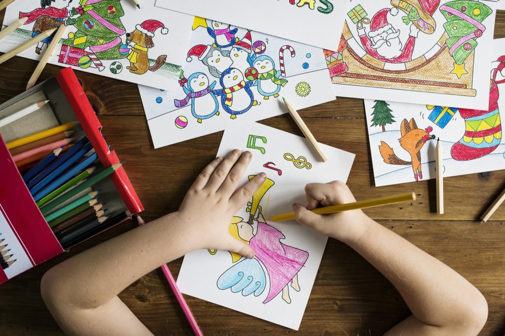 Child drawing and coloring