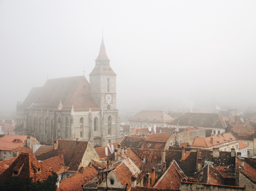 A Gothic style Romanian town shrouded in mist.