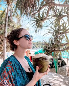 Woman drinking in a coconut