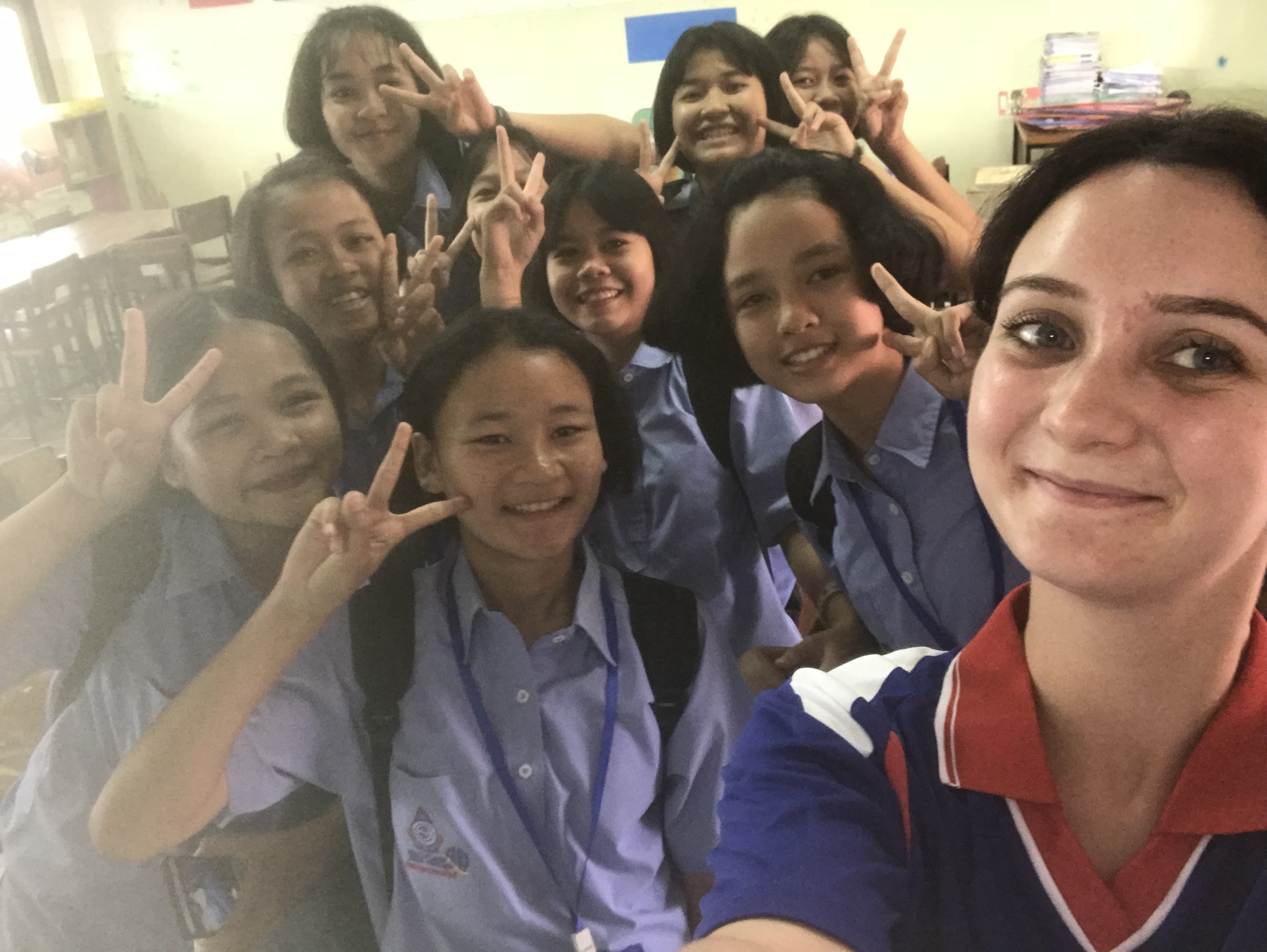 Jenny taking a selfie with her students.