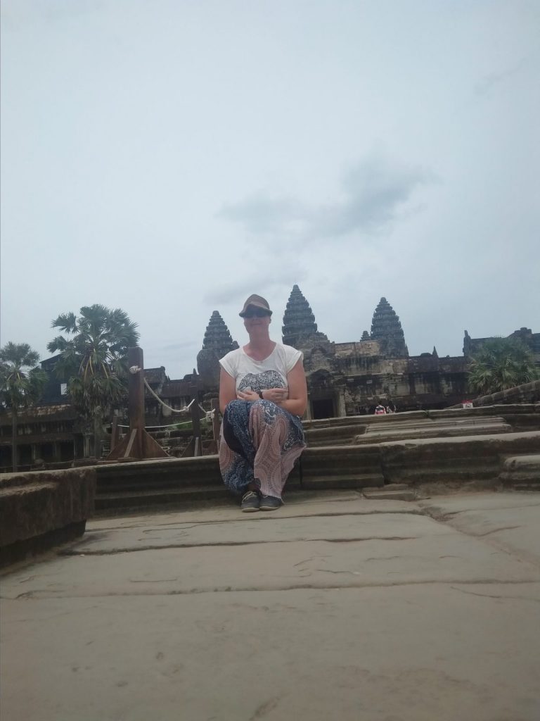 Tanya posing outside a temple