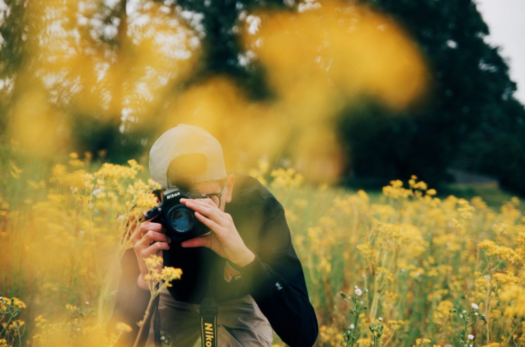 Photographer capturing flowers