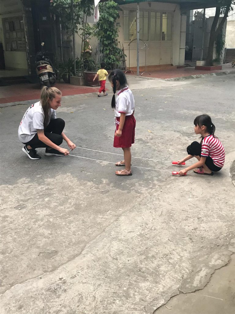 Teacher and student playing in Vietnam