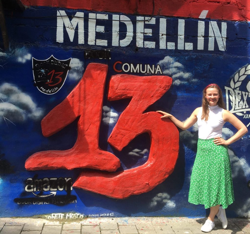 TEFL Student in South America pictured with mural